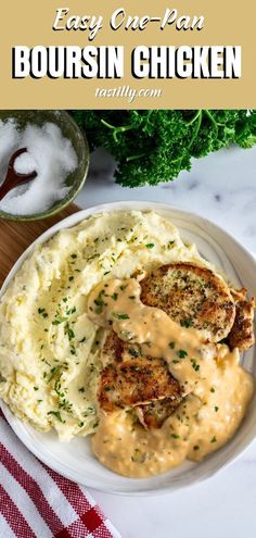 a plate with chicken and mashed potatoes covered in gravy