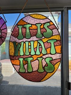 a stained glass sign that says, it's your tis on the side of a window