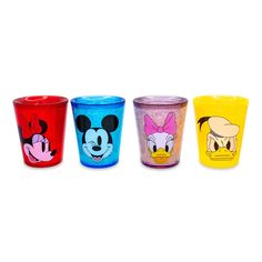 four different colored cups with cartoon characters on them