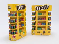 two display cases filled with different types of gummy bears and m & m's