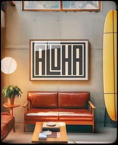 a living room with two couches and a surfboard on the wall behind it