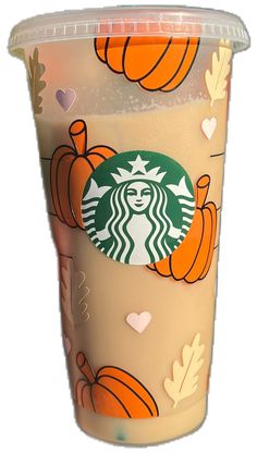 a starbucks cup with pumpkins and leaves on it