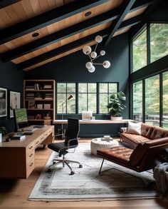 a living room filled with furniture and lots of windows