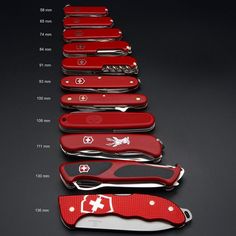 the swiss army knifes are lined up in rows