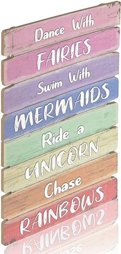 a wooden sign that says, dance with fairiess swim with mermaids ride an unicorn chase rainbows