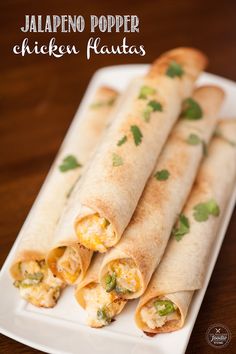 chicken fajitas on a plate with cilantro and jalapeno popper