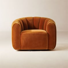 an orange chair sitting on top of a white floor