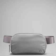 In Hand And Ready To Be Picked Up Or Shipped Out To You! Brand New With Tags Lululemon Everywhere Belt Bag In Silver Color: Silver Sz: Os Material: Water Repellent Fabric Dimensions: Bag Dimensions: 19cm X 5.5cm X 13cm (7.5" X 2" X 5") Strap Length When Fully Extended: 125cm (49.2") Lululemon Fanny Pack, Running Belt, Bag Silver, Festival Bag, White Belt