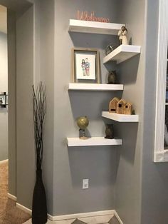 some shelves in the corner of a room