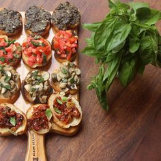 an assortment of appetizers are displayed on a cutting board