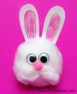 a close up of a stuffed animal on a pink background with the words happy easter written below it