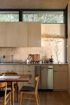 the kitchen is clean and ready to be used as a dining room or office space