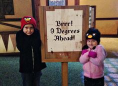 two children standing in front of a sign that says don't 3 degrees ahead