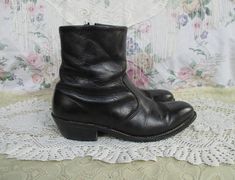 Nice black leather Chelsea style ankle boots made by HH in the USA. These have a Western style embroidery on the pointed toes, and some unique embroidery around the ankles as well. The soles look like nice quality and are stitched. There is a zipper on the inside ankle for ease in getting on. Lined in a brown material. There is some general wear, most notably some scuffing and some wear and a scratch in the toe area. But overall these are lovely and ready to wear! The soles have a squishy padding. Sizing: I can't quite make out the size written on the lining so go by the measurements below.  Measurements are in inches.  Length of inside sole: 11 6/8 Width at ball of foot: 3 3/4 Heel: 2 Rise, sole to top of boot: 8 1/2 Follow @lunarhovel on instagram for new items posted every week and sale Vintage Fitted Boots For Festivals, Vintage Fitted Festival Boots, Punk Bohemian, Beatle Boots, Ankle Dress, Unique Embroidery, Mens Cowboy, Cuban Heels, Dress Boots