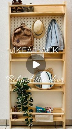 a wooden shelf filled with hats and other items on top of a tiled floor next to a wall