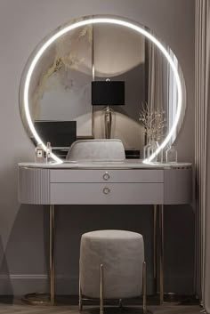 a white vanity with a round mirror and stool