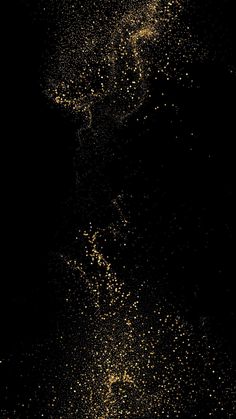 a black background with yellow speckles on it