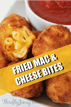 fried mac and cheese bites on a plate next to a bowl of tomato sauce with the words fried mac and cheese bites