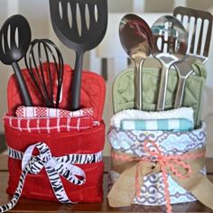 kitchen utensils are sitting in a holder on a table next to each other