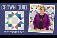 a woman standing in front of a quilt with the words crown quilt written on it