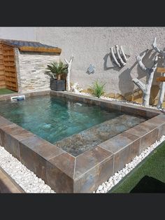 an outdoor hot tub with water running through it