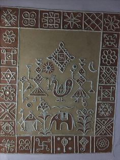 an intricately designed wall hanging in the shape of a square with elephants and other symbols