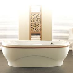 a large white bath tub sitting in a bathroom