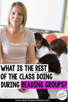 a woman standing in front of a group of children