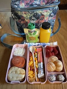 the lunch box is full of fruit, vegetables and other foods to go with it