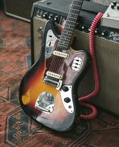 an electric guitar and amp sitting on the floor