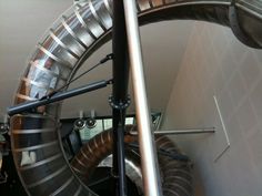 the inside of a large metal object in a room