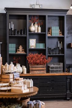 a black bookcase filled with lots of books