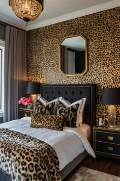 a bedroom with leopard print on the walls