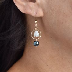 *Designer Favorite!* So dainty and fun to wear! Small hand made hoops accented with mother of pearl Pikake beads and a beautiful lustrous freshwater pearl. These earrings gently sway with your every movement and will quickly become a favorite in your collection. See the matching necklace here! https://www.etsy.com/listing/1015078758/small-pikake-hoop-necklace-with-pearl Your choice of sterling silver or gold fill. This material will not tarnish and can even get wet! Black Pearl Jewelry, Pearl Earrings Designs, Hoop Necklace, Tahitian Pearl Earrings, Black Pearl Earrings, Hawaiian Jewelry, Pearl Bangle, Basic Jewelry, Miniature Houses