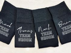 five pairs of socks with the names of team grooms and bridesmaids on them