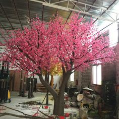 a pink tree is in the middle of a room