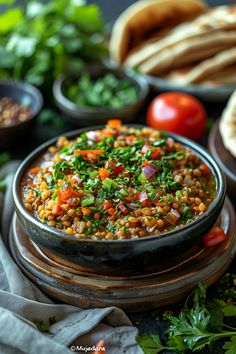 A bowl of lentil and vegetable stew garnished with chopped herbs, surrounded by fresh ingredients and pita bread. Authentic Mujadara Recipe, Lebanese Mujadara Recipe, Lebanese Recipes Authentic, Mujadara Recipe, Lentils Rice, East Recipes, Arabic Recipes, Lebanese Cuisine