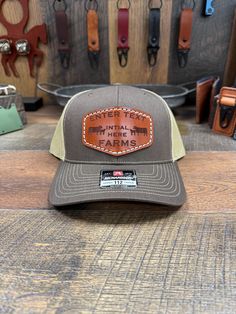 * Hand made in Liberty Ky * Custom Farm Hat Leather Patch Hat * Enter name and initial for hat in personalization box * I do offer custom patch's as well just message me  * You can check my Facebook page to see all my work.   https://www.facebook.com/profile.php?id=61551507831444&mibextid=LQQJ4d Custom Leather patch hats, Richardson 112 snap back. Hand Stitching for durability and longevity. I use top grade leather from Wicket & Craig English Bridle with Ritza Tiger Thread stitching. Each patch will be Top coated with resolene for a medium to high gloss finish, Water resistant acrylic top finish. There will be 5 colors of leather to choose from and a variety of stitching colors. I also offer/carry 13 colors of leatherette for a more vibrant look.  I do offer many more hat color options, if Leather Hat Patch Ideas, Farm Hat, Leather Patch Hat, Patch Hats, Patch Top, Mesh Flats, English Bridle, Patch Hat, Hat Patches