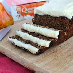 two slices of cake sitting on top of a wooden cutting board