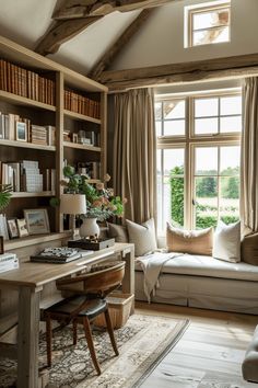 a living room filled with lots of furniture and bookshelves next to a window