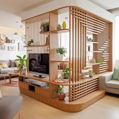 a living room filled with lots of furniture and plants on top of shelves in front of a flat screen tv