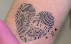 a couple of finger prints that are on someone's arm with the date 2013 and two hearts