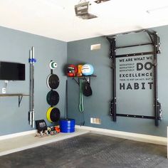 a garage with various tools and equipment hanging on the wall, including an overhead pull up bar