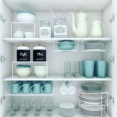 the shelves are filled with dishes and cups