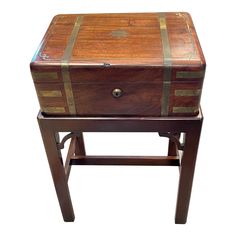 an old trunk is sitting on top of a stool