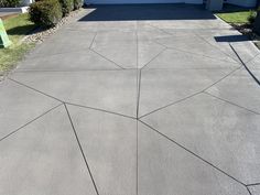 An image of stenciled concrete driveway project Ceaserstone Cloudburst Concrete, Grey Aggregate Driveway, Driveway Exposed Aggregate, Dark Exposed Aggregate Driveway, White Exposed Aggregate Concrete