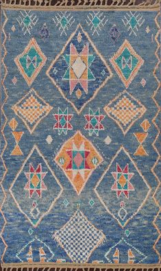 an old rug with many different colors and designs on it's sides, including diamonds