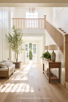 a living room filled with lots of furniture and a tree in the middle of it