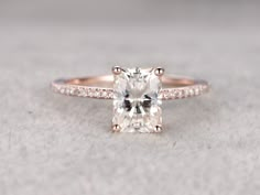 an engagement ring with a cushion cut diamond