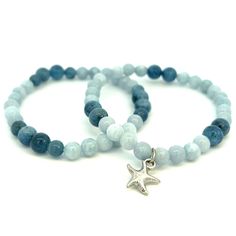 This is a set of two Natural Gemstone Aquamarine stretch bracelets with a silver tone starfish charm. This bracelet set is made with AAA Aquamarine beads. Aquamarine is the March birthstone. The Aquamarine beads are 6 mm and 7 mm. The starfish is plated with rhodium for lasting beauty. Aquamarine Bracelet, Aquamarine Beads, Aquamarine Jewelry, March Birthstone, March Birth Stone, Stretch Bracelets, Starfish, Bracelet Set, Aquamarine